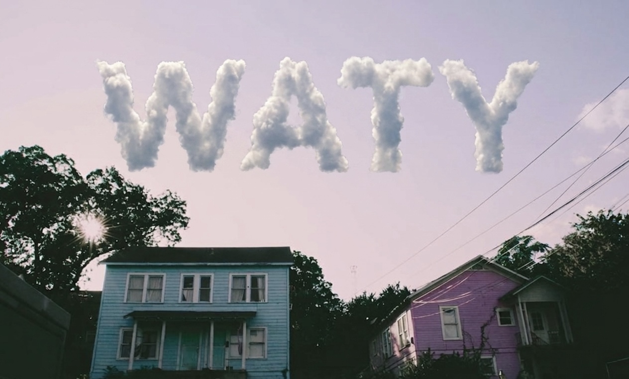The word WATY formed from clouds over pastel houses